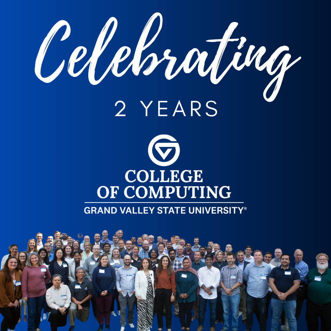 Image with blue background celebrating two years of the college of computing. with a group picture of the computing faculty and staff in the foreground